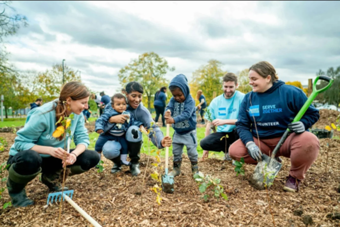 Young people participating together in hands-on community service